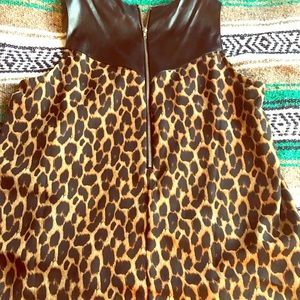 Cheetah print, pleather straps, half zip back. L